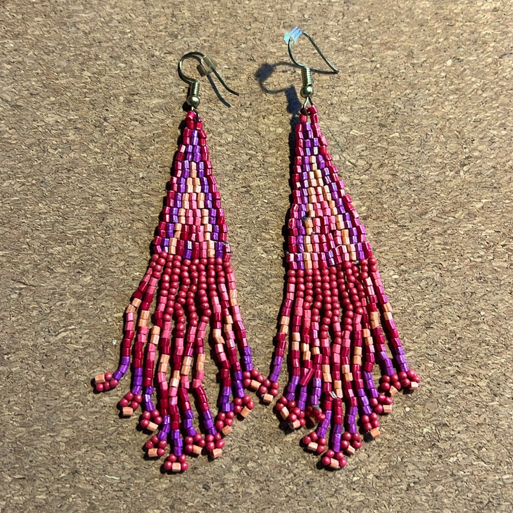 Dangling beaded pierced earrings.